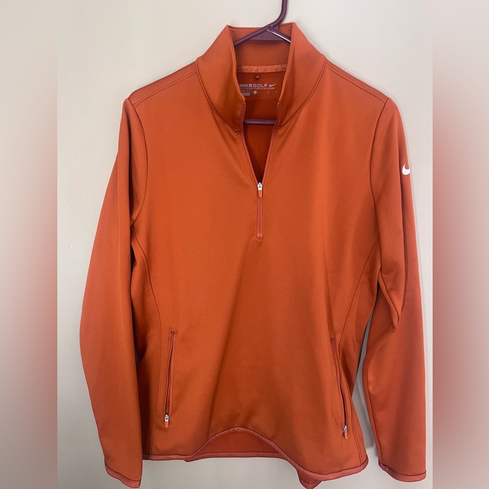 Nike Golf women's burnt orange quarter-zip pullover with zippered pockets